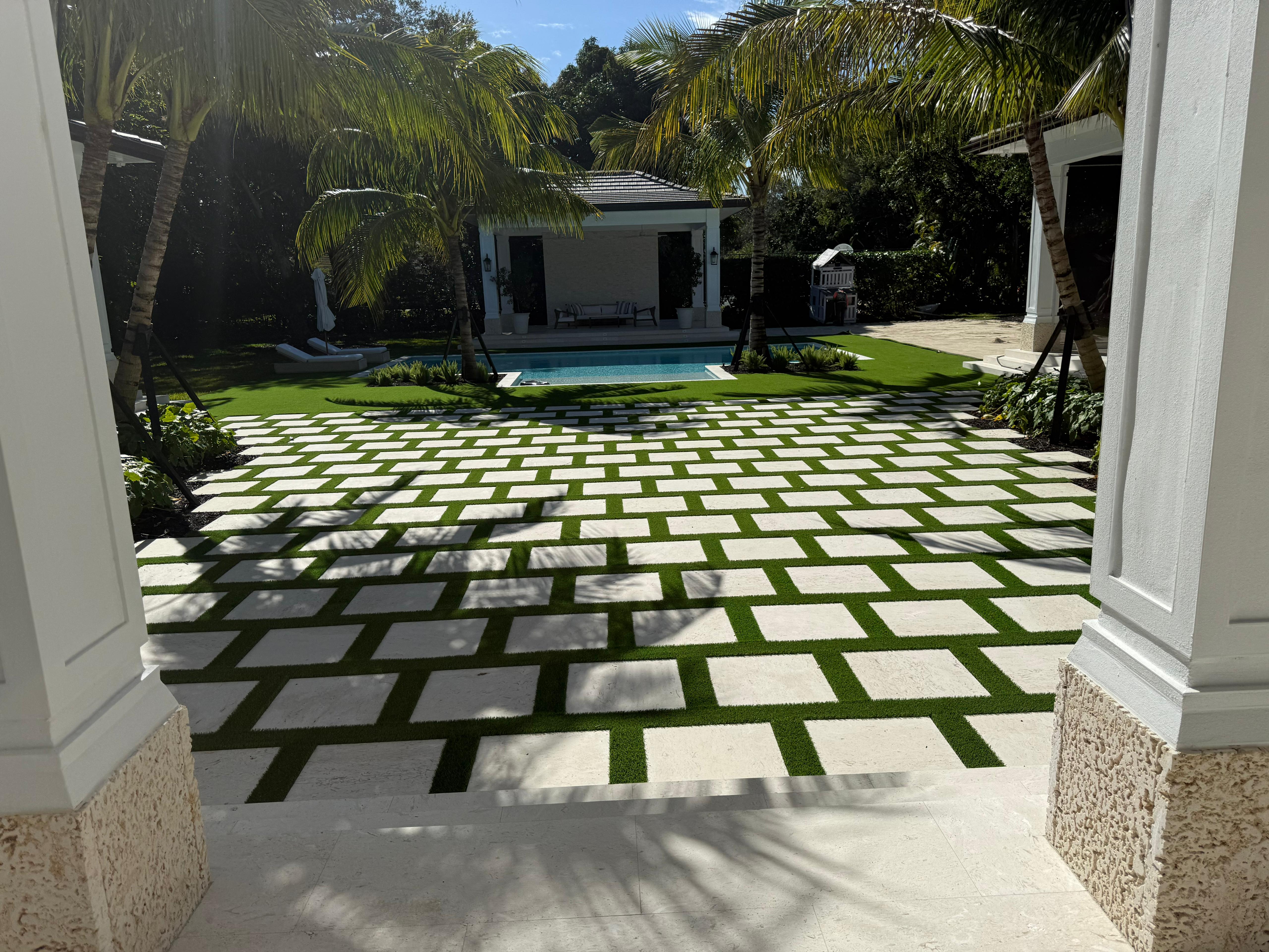 Paver driveway with artificial grass Coral Gables